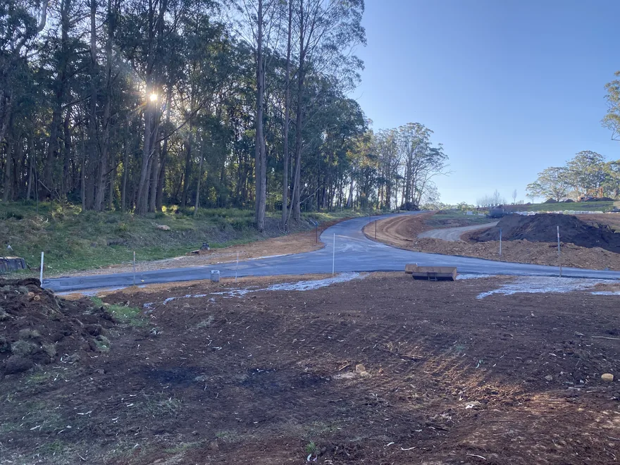 Newly formed road through bushland with the shoulder graded