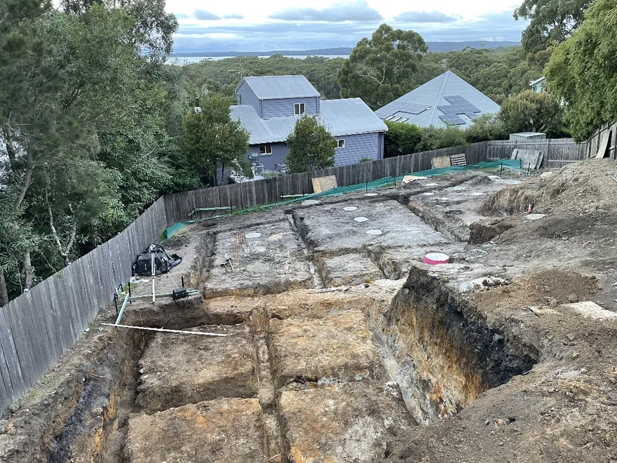 Residential block cut for a new build, with the batter benched back