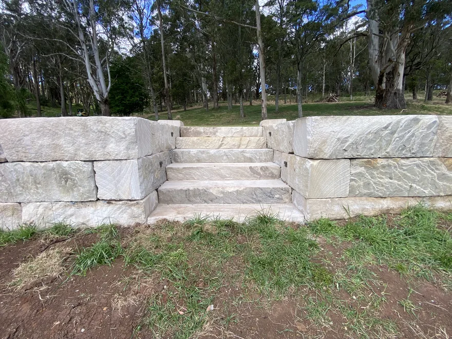 Finished sandstone block retaining wall with steps